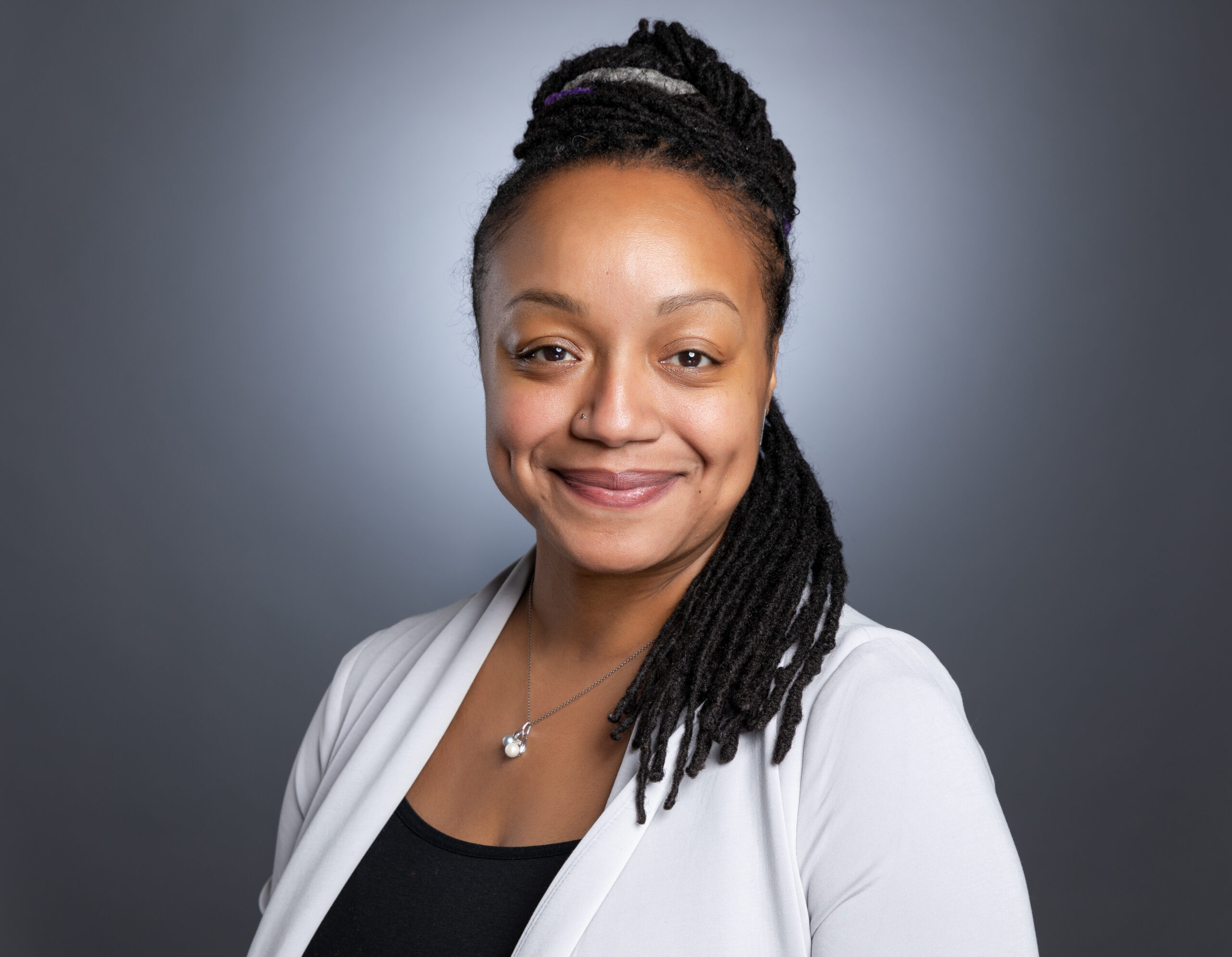 Headshot of Dr. Roth with black background